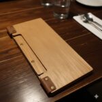 Custom wooden wine list cover with engraved logo